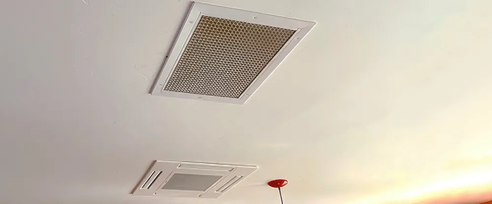Photo of air vents on ceiling.