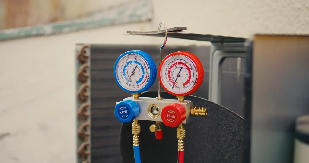 Gauges connected to an AC unit. Checking for freon levels
