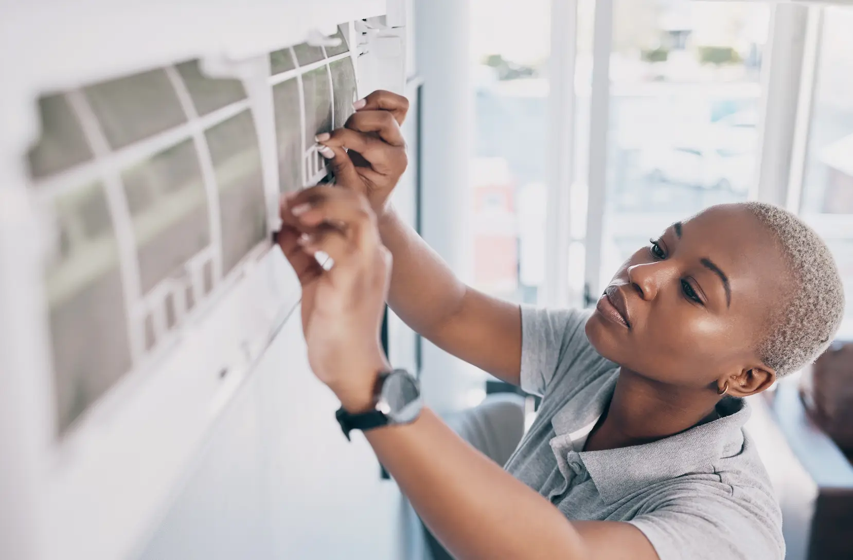 woman installing mini-split ac