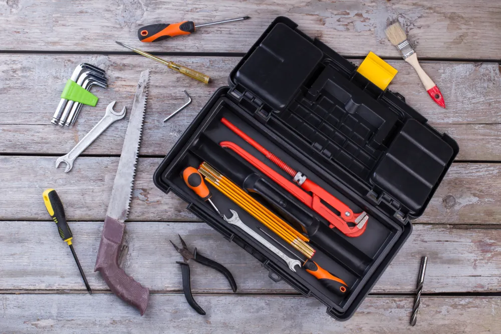 Set of construction tools on wooden background