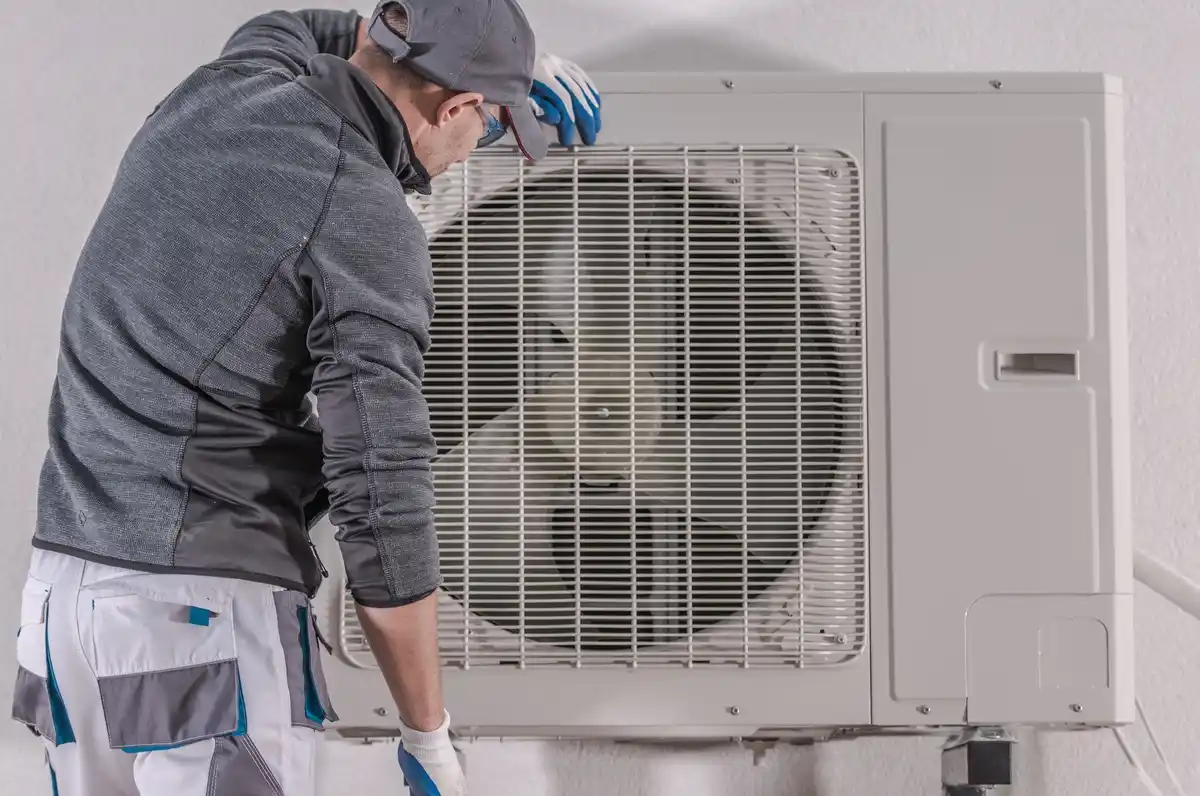 Technician tuning heat pump
